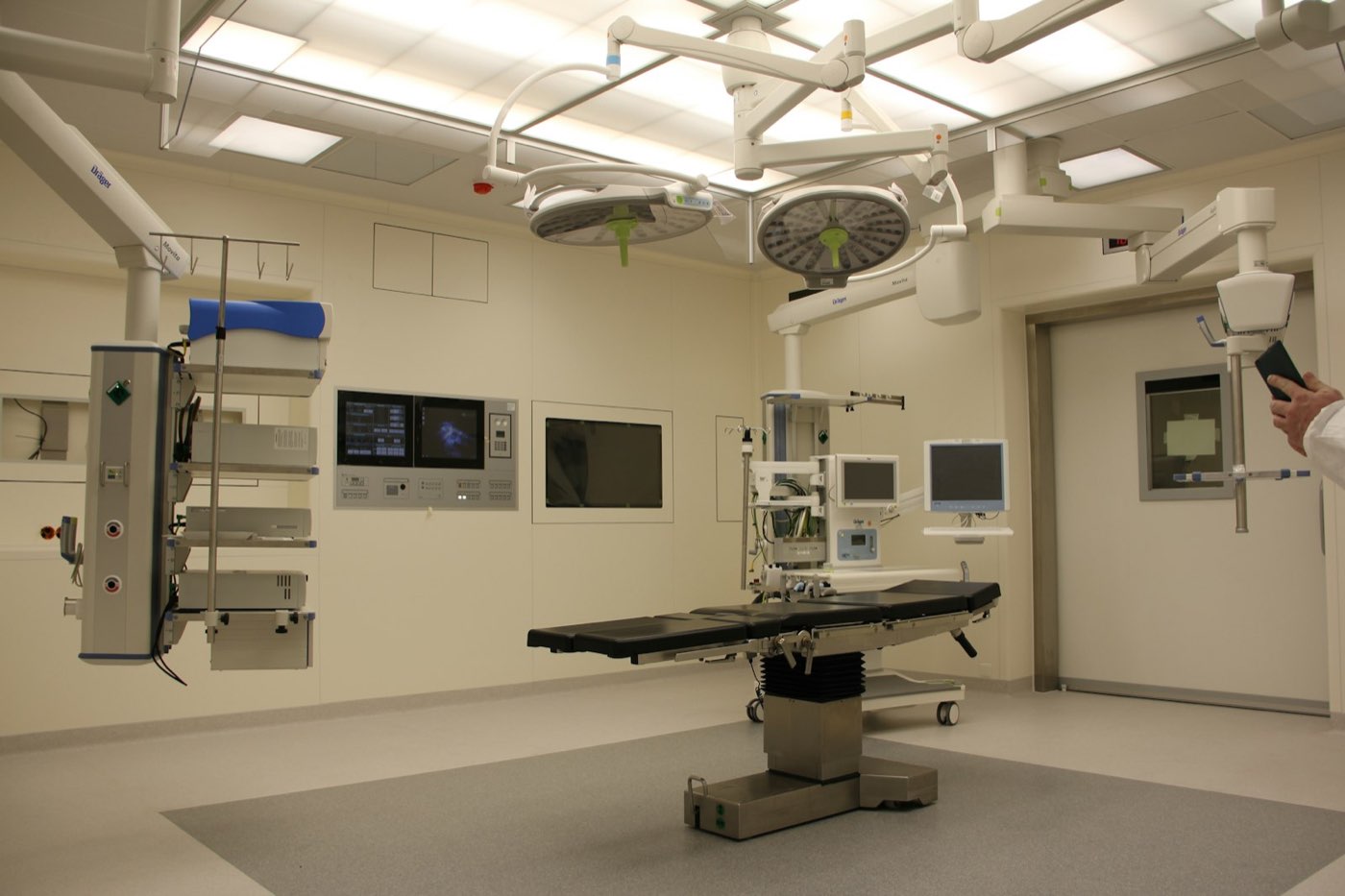 An operating theatre prepared with equipment and lighting